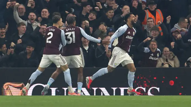 Aston Villa's Douglas Luiz (centre) celebrates scoring their side's first goal