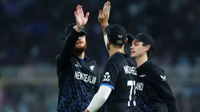 New Zealand's Finn Allen and Daryl Mitchell celebrate the wicket of South Africa's David Miller