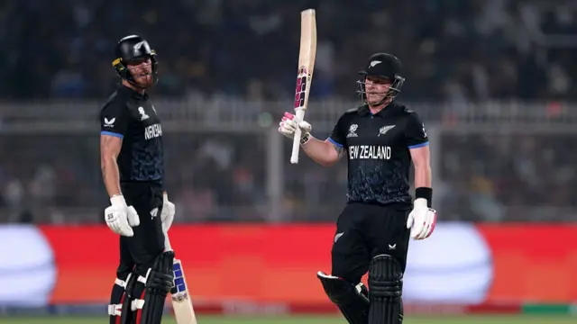 Tim Seifert of New Zealand celebrates reaching his half century