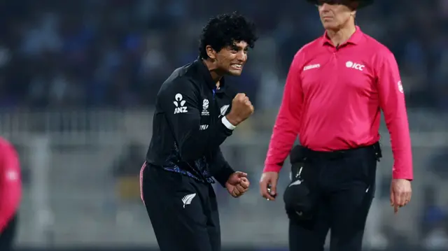 New Zealand's Rachin Ravindra celebrates the wicket of South Africa's David Miller