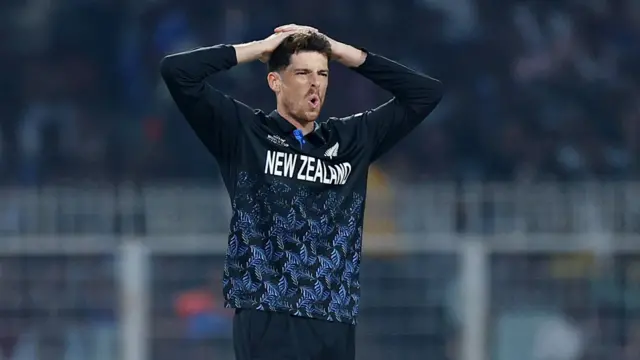 New Zealand's Mitchell Santner reacts