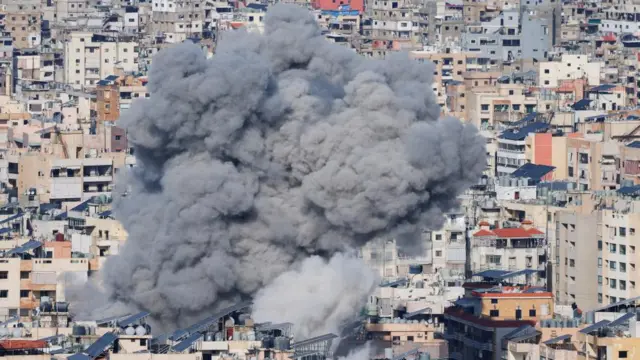 Smoke rises over buildings after an Israeli strike on Beirut's southern suburbs