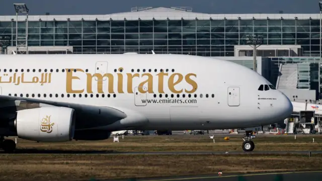An Emirates plane with German tourists evacuated from the Middle East arrives from Dubai, at the airport in Frankfurt