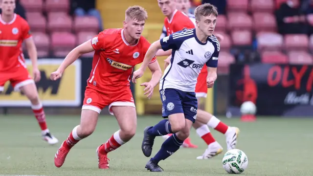 Cliftonville's Odhran Casey and Portadown's James Teelan