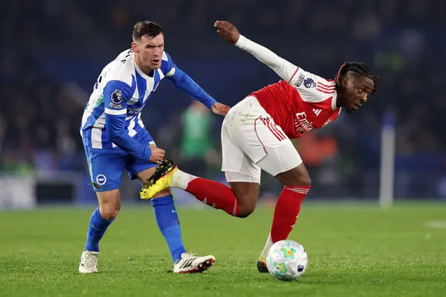: Eberechi Eze of Arsenal is challenged by Pascal Gross of Brighton & Hove Albion during the Premier League match between Brighton & Hove Albion and Arsenal at Amex Stadium on March 04, 2026 in Brighton, England.