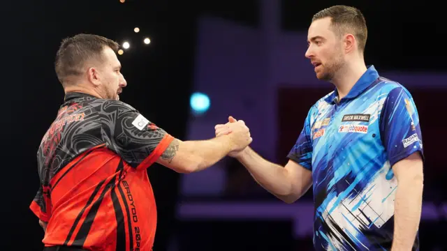 Wales' Jonny Clayton (left) after winning his match against England's Luke Humphries on night five of the BetMGM Premier League 2026 at Utilita Arena, Cardiff
