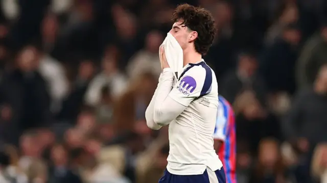 Archie Gray puts his shirt over his face