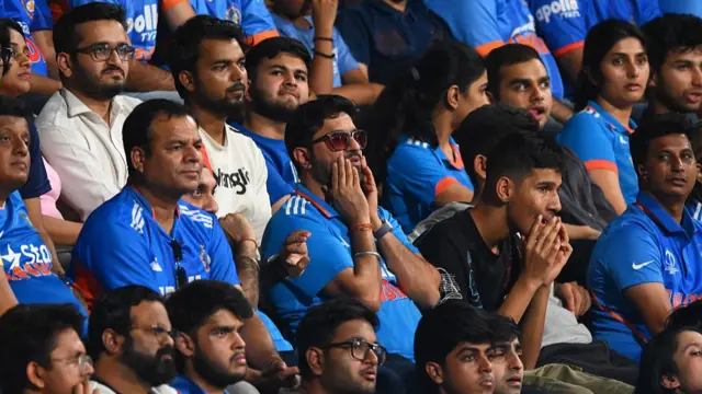 : Spectators react in the crowd during the ICC Men's T20 World Cup India & Sri Lanka 2026 Semi-Final match