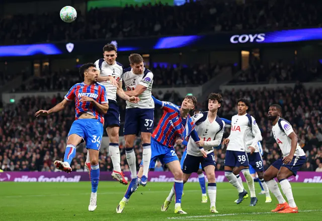 Chadi Riad of Crystal Palace competes for a header with Joao Palhinha and Micky van de Ven o