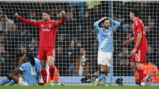 Bernardo Silva reacts with his hands on his head