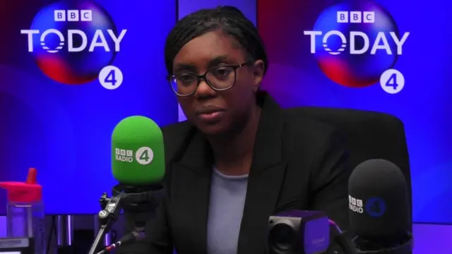 Kemi Badenoch sits behind a mic in the Today programme studio