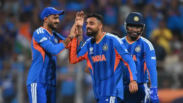 Varun Chakravarthyof India celebrates the wicket of Jos Buttler