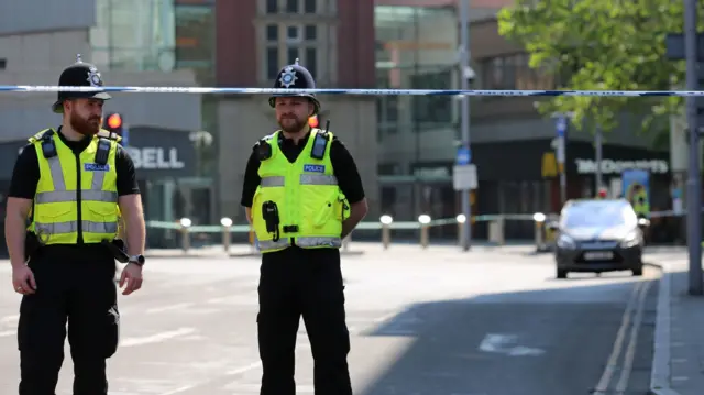 Two police officers on a street