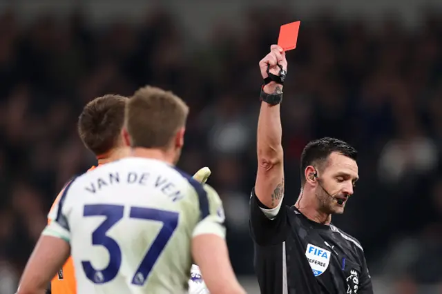 Referee Andrew Madley shows a red card to Micky van de Ven