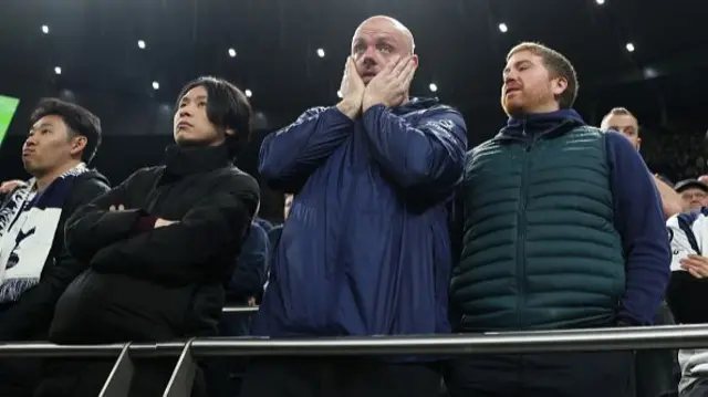 Supporters of Tottenham Hotspur look dejected