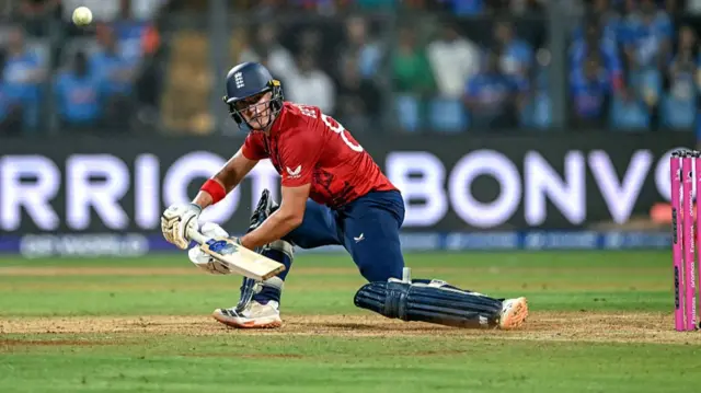 England's Jacob Bethell plays a shot
