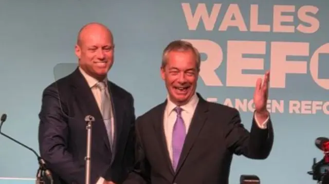 Nigel Farage and Dan Thomas on stage
