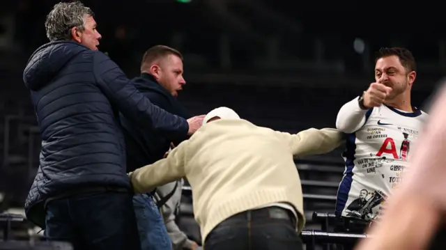 Fans fight in the stands