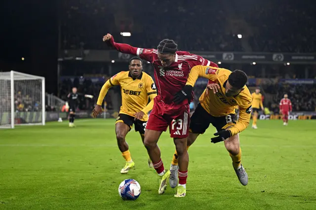 Rio Ngumoha under pressure from Wolves defenders