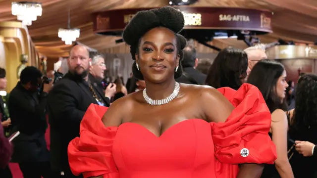 Wunmi Mosaku in a red dress at the Actors Awards in Los Angeles