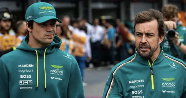 Lance Stroll and Fernando Alonso walk in the paddock in Melbourne