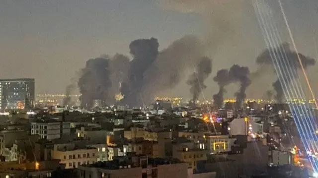 A screengrab from a verified video showing several smoke plumes after air strikes in Tehran