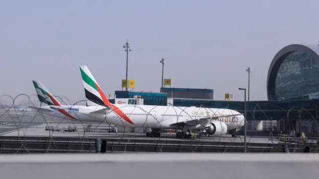 Planes are parked at Terminal 3 of the Dubai International Airport, following the United States and Israel strikes on Iran, in Dubai, United Arab Emirates, taken on March
