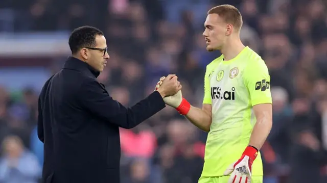 Liam Rosenior shaking the hand of Filip Jorgensen