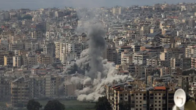 Thick smoke rises from an area of tower blocks in Beirut