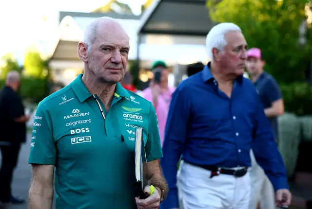 Adrian Newey walks through the paddock with Aston Martin owner Lawrence Stroll