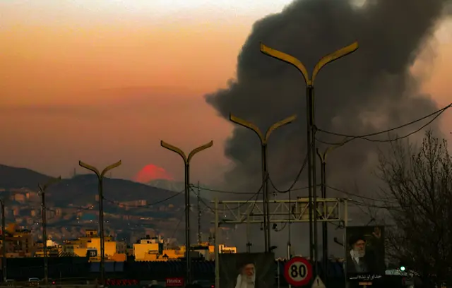 Smoke rises over part of Tehran after strikes on the city.