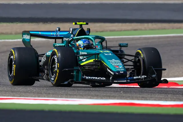 Fernando Alonso drives the Aston Matin on track in Bahrain
