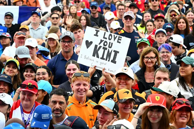 Fans hold up sings for Kimi Antonelli