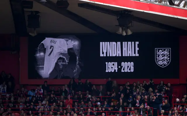 A screen is seen in memory of former England player Lynda Hale prior to the 2027 FIFA Women's World Cup Qualifier between England and Iceland at City Ground on March 07, 2026 in Nottingham.