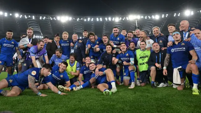 Italy celebrate on the pitch