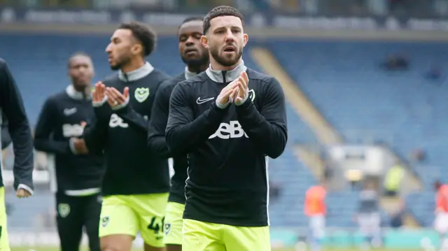 Portsmouth players warm up at Ewood Park before the game with Blackburn Rovers