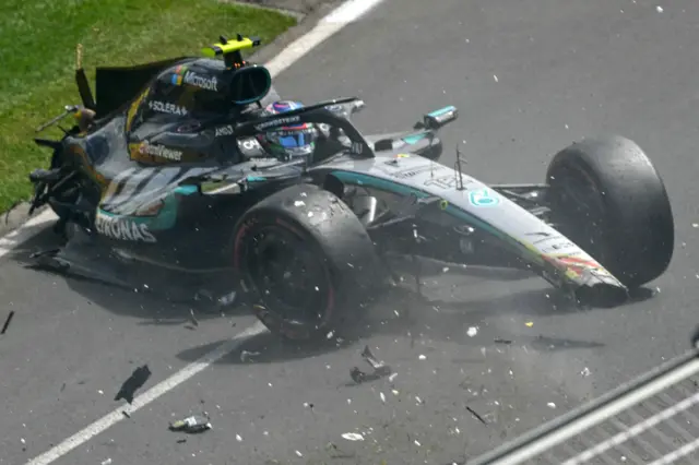 Debris flies from the Mercedes of Kimi Antonelli after his crash in Australian Grand Prix practice