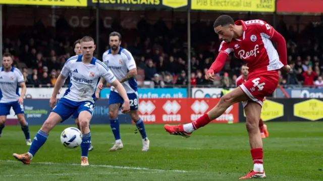 Klaidi Lolos of Crawley Town has a shot at goal