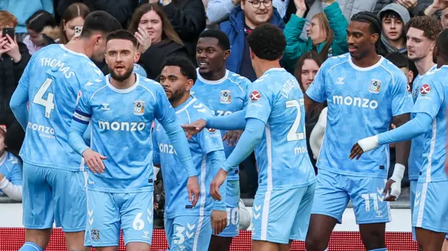 Coventry players celebrate a goal in their 2-1 win over Stoke