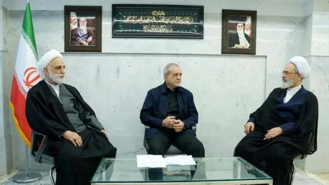 ranian President Masoud Pezeshkian, Gholam-Hossein Mohseni-Eje'i, the head of the judiciary and Alireza Arafi, deputy chairman of the Assembly of Experts, attend the meeting of the interim leadership council of Iran in an unknown location