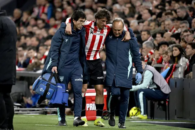Athletic Bilbao's Spanish midfielder #20 Unai Gomez injured leaves the pitch