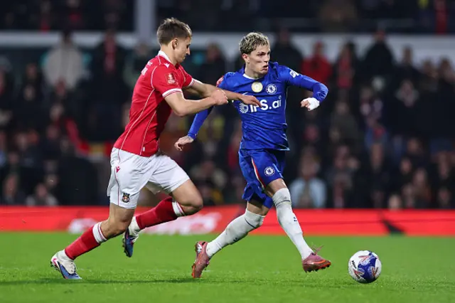 Max Cleworth of Wrexham and Alejandro Garnacho