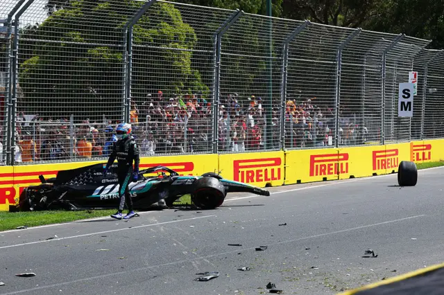 Kimi antonelli walks away from his damaged Mercedes after crashing in Australian Grand Prix practice