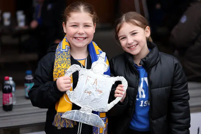 Mansfield Town fans holding tin foil FA Cup trophy