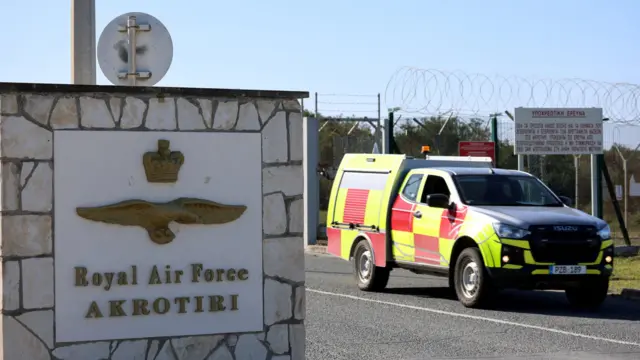 A car drives out of the entrance of RAF Akrotiri, a British sovereign base in the country, as the conflict in the Middle East intensifies, Cyprus March 5, 2026.