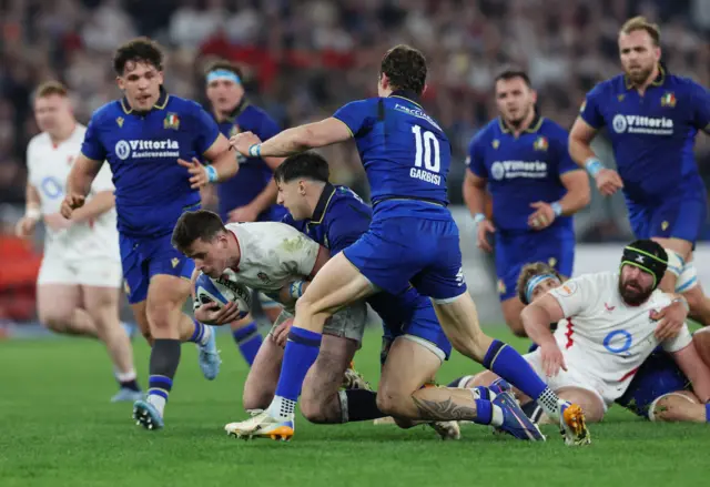 England's Seb Atkinson in action with Italy's Paolo Garbisi REUTERS/