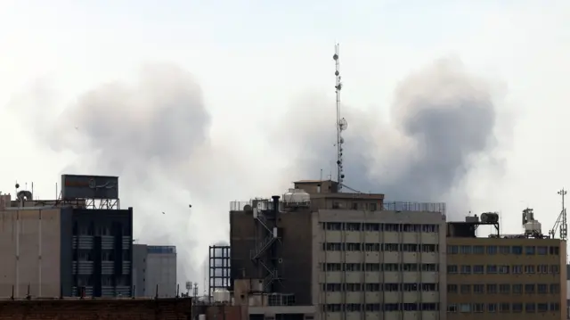 Smoke rises after an airstrike in Tehran