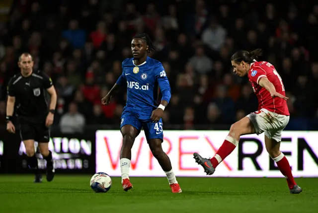 Romeo Lavia of Chelsea runs with the ball whilst under pressure