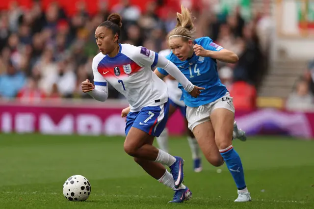 England's sLauren James runs away from Iceland's Hlín Eiríksdóttir during the Women's FIFA world cup league A, group 3, qualifier football match between England and Iceland at The City Ground in Nottingham, March 7, 2026.