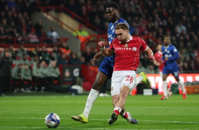 Wrexham's Sam Smith scores their first goal